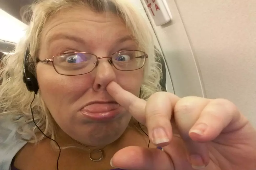 Sarah Dyer Entertains Herself On The Plane With The B98.5 App