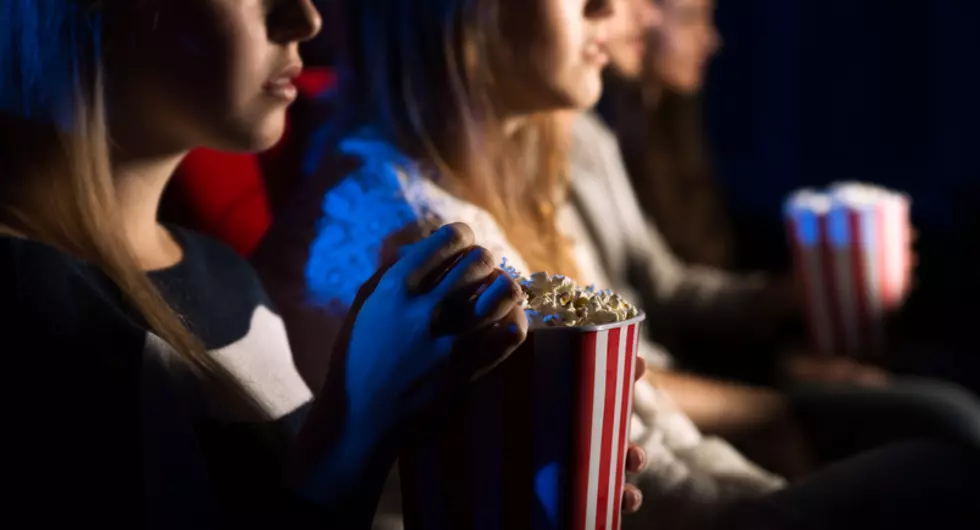 Friends at the cinema watching a movie