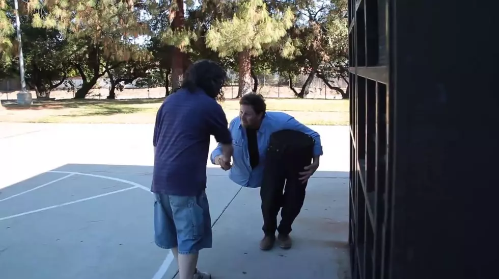 Can You Figure Out How This Magician Makes Himself Look Cut in Half? [VIDEO]