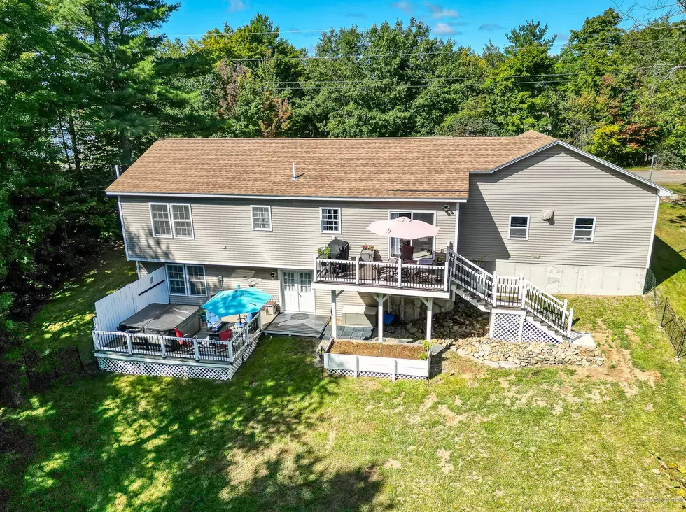You’ll Never Run Out of Space to Entertain in This Gorgeous Central Maine Home w/ Hot Tub, Multiple Decks & Basement Bar!