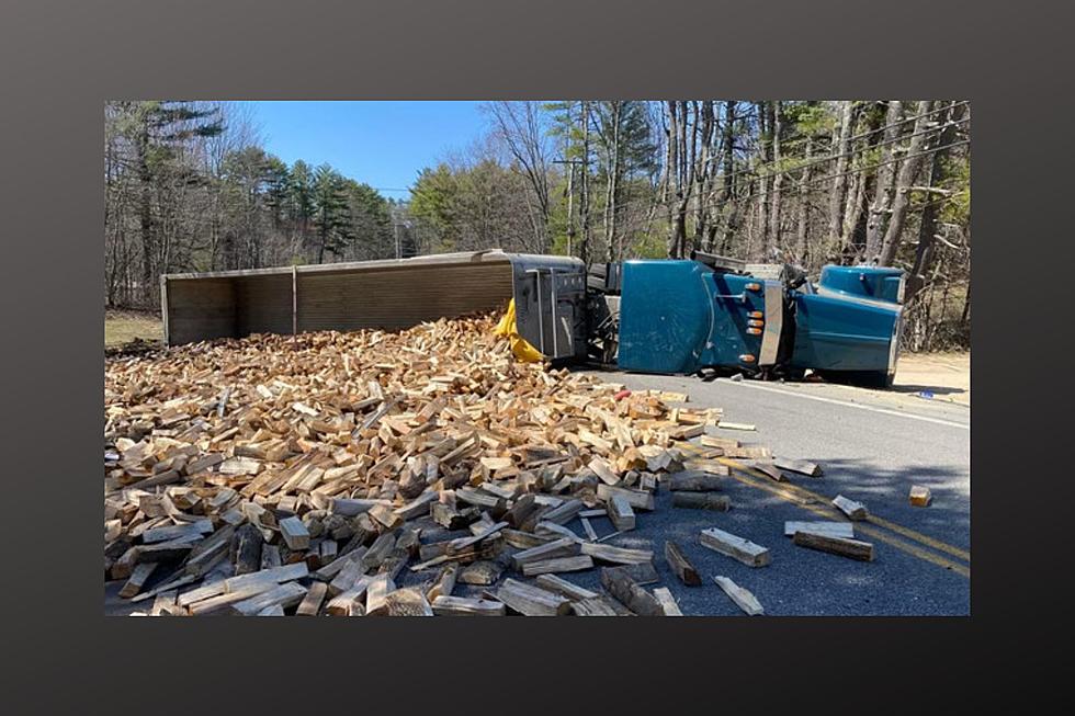 Tractor Trailer Hits Guard Rail in Maine, Tips Over & Spills Apparent Firewood in Roadway