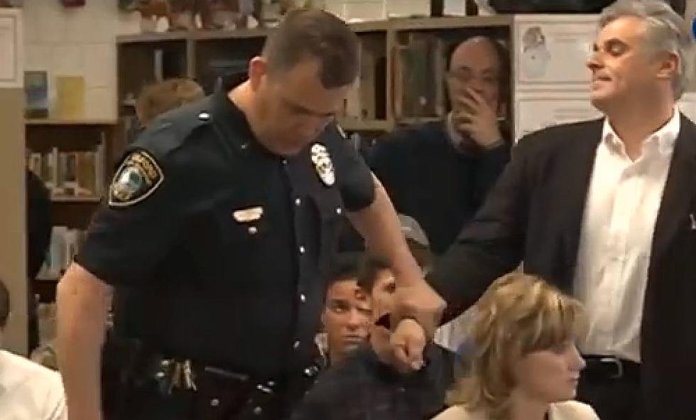 A Concerned Parent at a School Board Meeting Gets Arrested for What?
