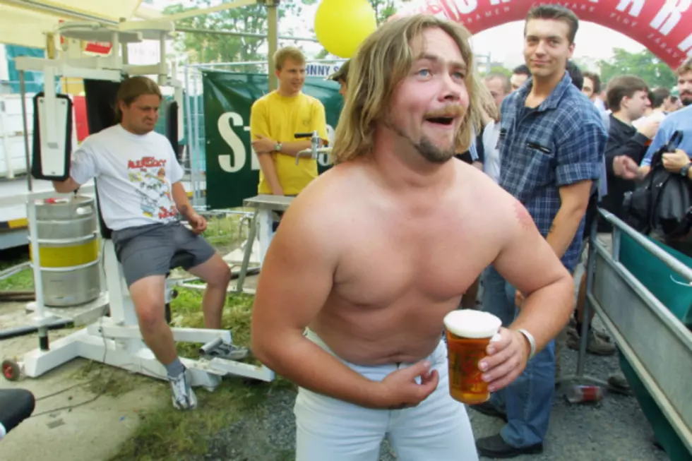 Beer Muscles Put to Good Use in England [VIDEO]