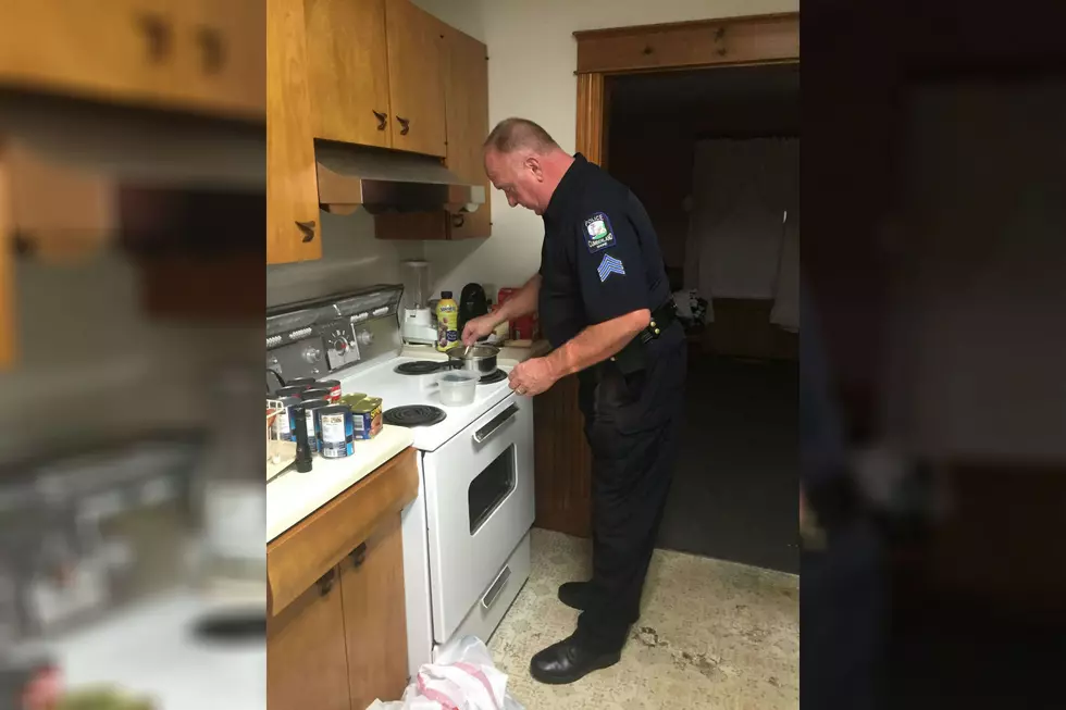 Photo Of Maine Police Sergeant Cooking For Elderly Man Goes Viral