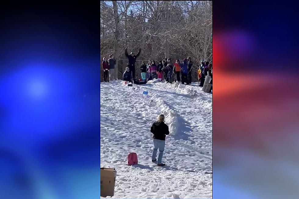 Kids Cheer as Oxford Cop Slides Downhill on a Cardboard Cruiser