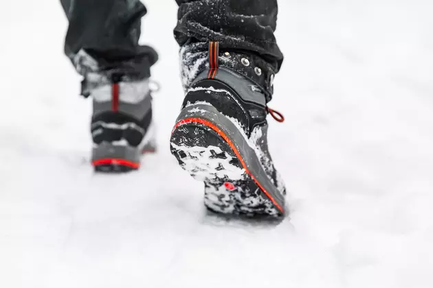 Hiking boot closeup, winter walking in snow. Closeup of winter shoes.
