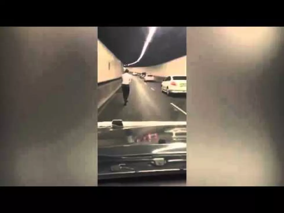 Watch Man Ride Push Scooter Through Busy City Tunnel [VIDEO]