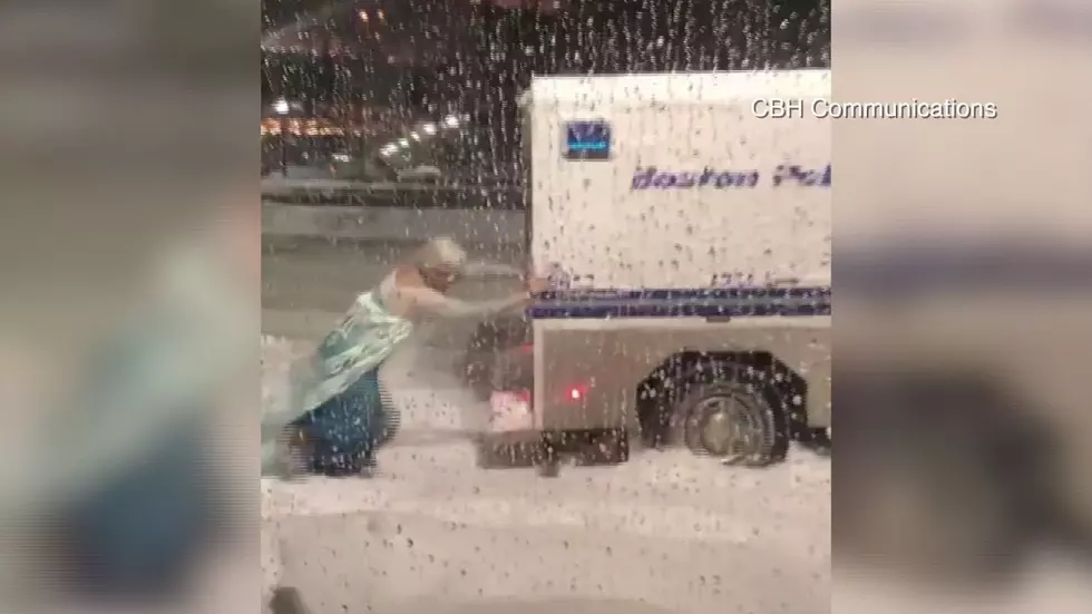 Watch Man Dressed As ‘Elsa’ Free Boston Police Car From Snowbank