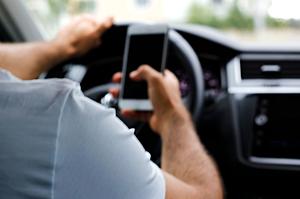 What You Need To Know About Holding Your Cell Phone While Driving...