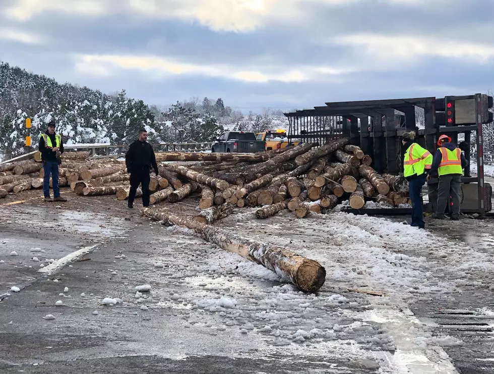 Driver Hurt, Interstate 86 Closed After Truck Hauling Logs Overturns