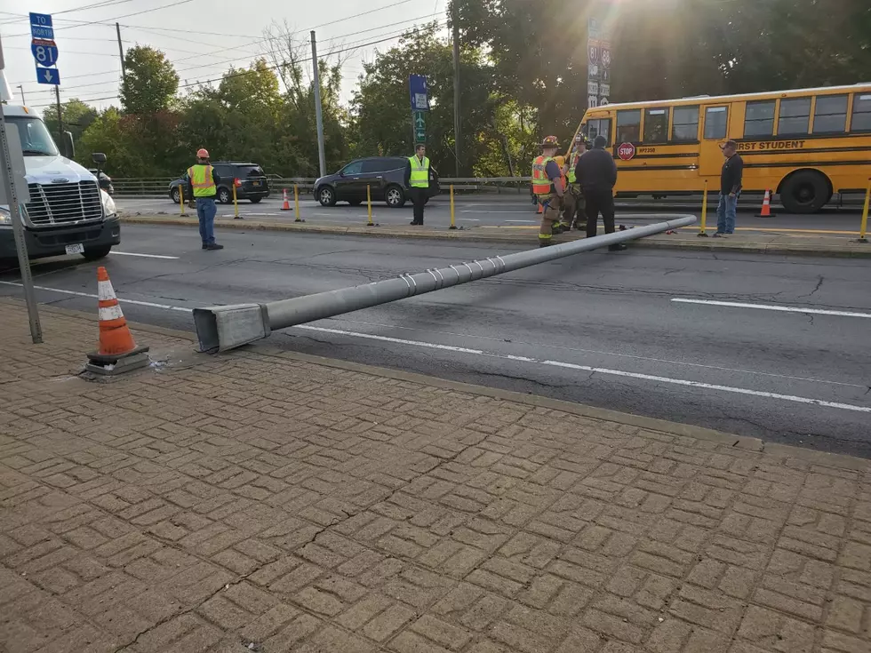 Utility Pole Knocked Down, Strikes Vehicle on Front Street
