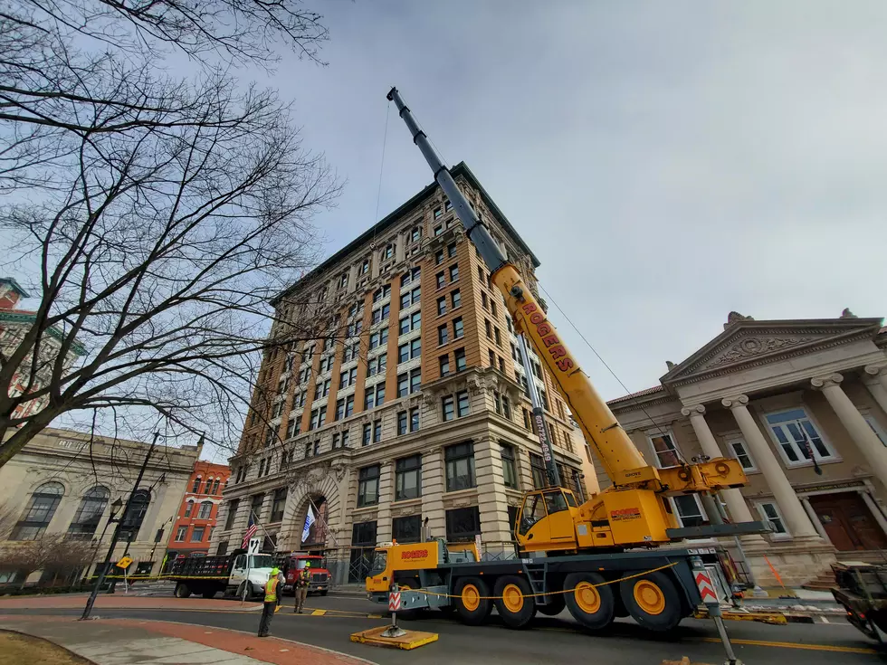 A crane was used to lift construction materials to the top of the Security Mutual Building on March 16, 2022. (Photo: Bob Joseph/WNBF News)