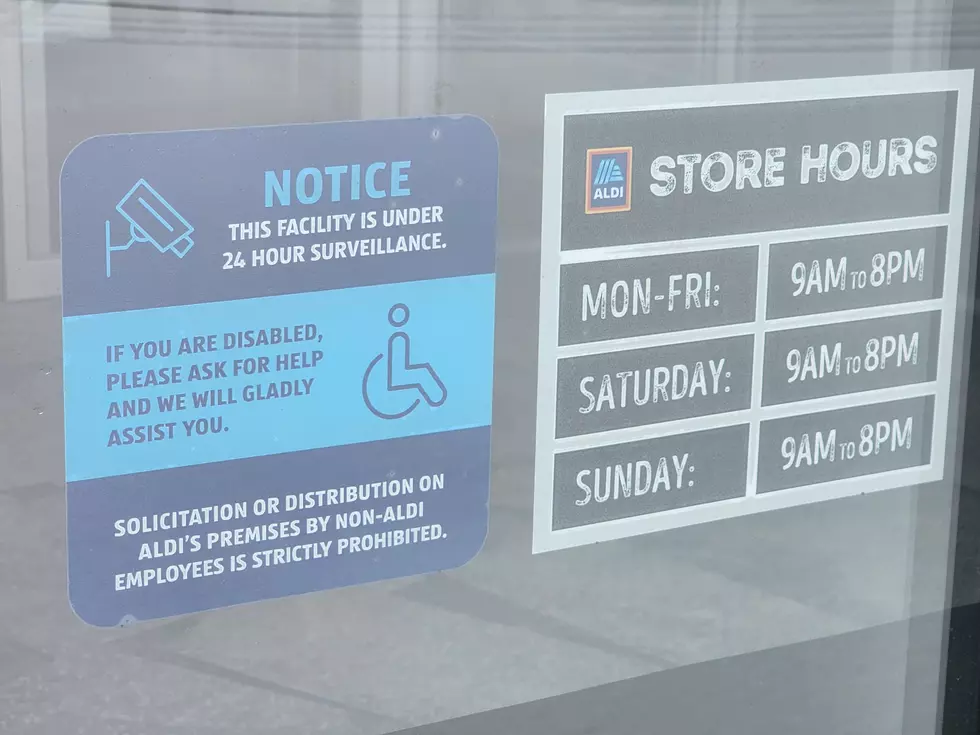 The Owego Aldi operating hours are posted at the store entrance. (Photo: Bob Joseph/WNBF News)