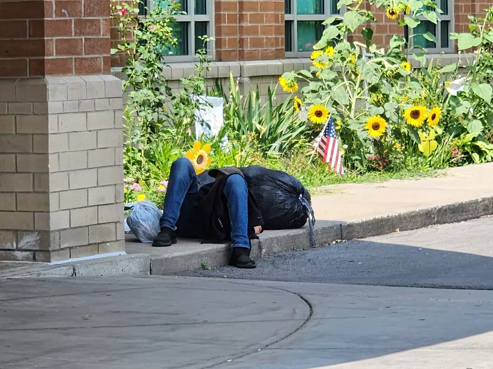 A man on a sidewalk near the Broome County Public Library front entrance on August 8, 2025. (Photo: Bob Joseph/WNBF News)