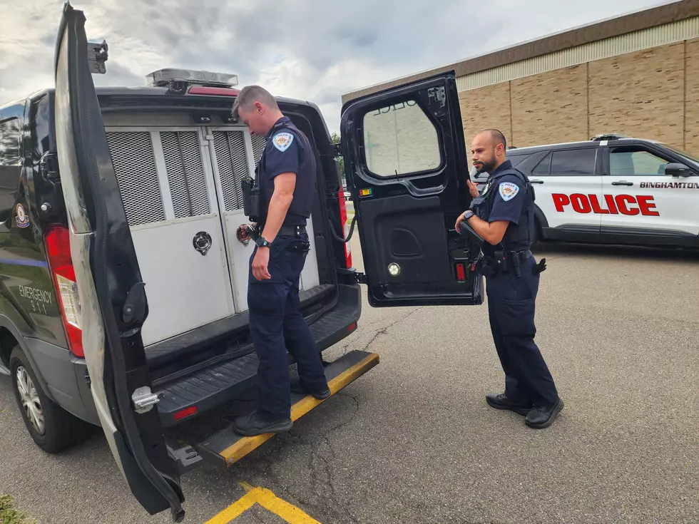 A Binghamton man was transported in a police van after two incendiary devices were found at a West Side home on August 19, 2025. (Photo: Bob Joseph/WNBF News)