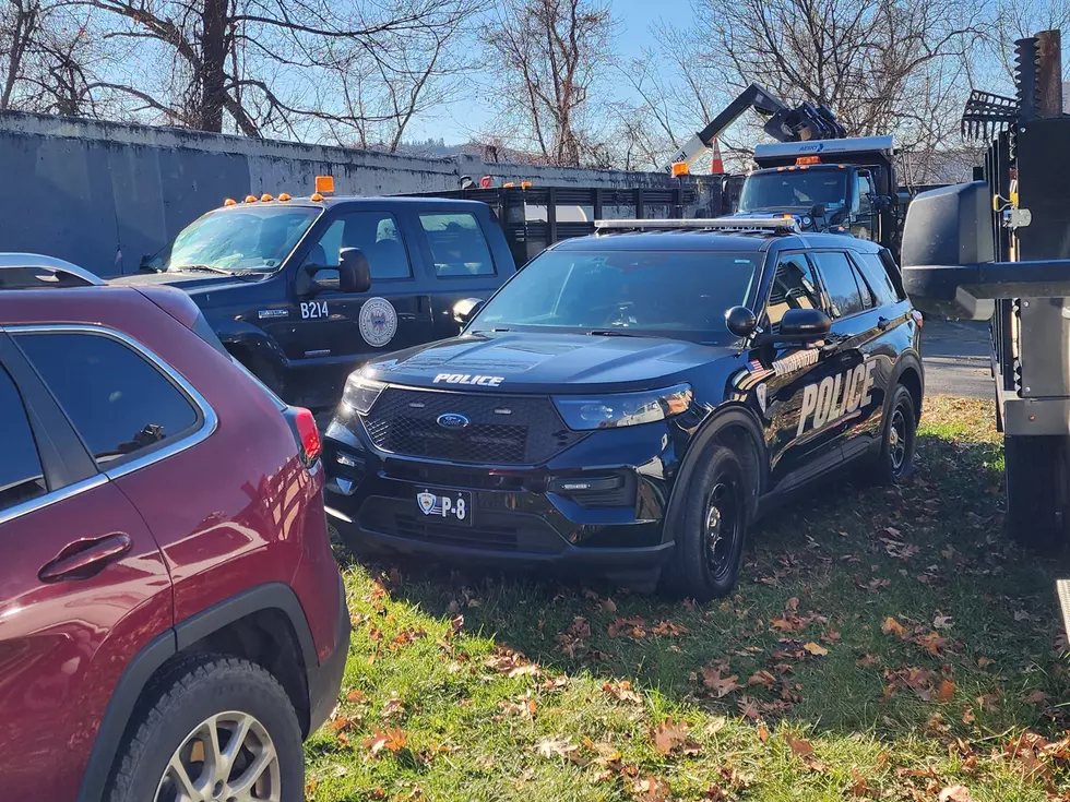 A Binghamton police SUV and several public works department vehicles were staged along a concrete flood wall along North Shore Drive on November 19, 2025. (Photo: Bob Joseph/WNBF News)