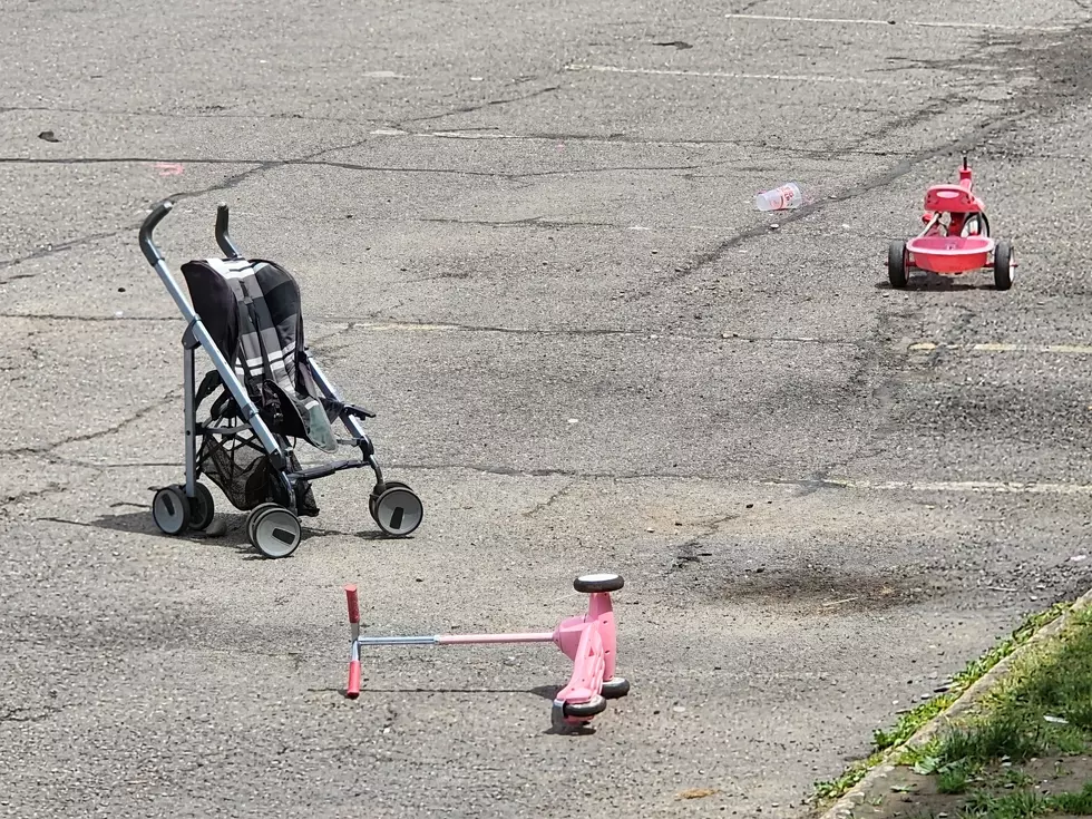 A stroller and children's toys were in the parking lot of the Hillside Inn & Suites motel on June 23, 2026. (Photo: Bob Joseph/WNBF News)