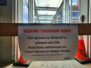 Broken Glass Panels Close Walkway Between Boscov's and Garage