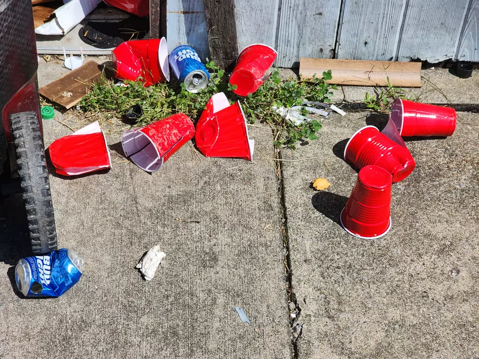 Beer cans and red plastic cups littered the sidewalk next to an apartment building at 162 Court Street on September 4, 2026. (Photo: Bob Joseph/WNBF News)