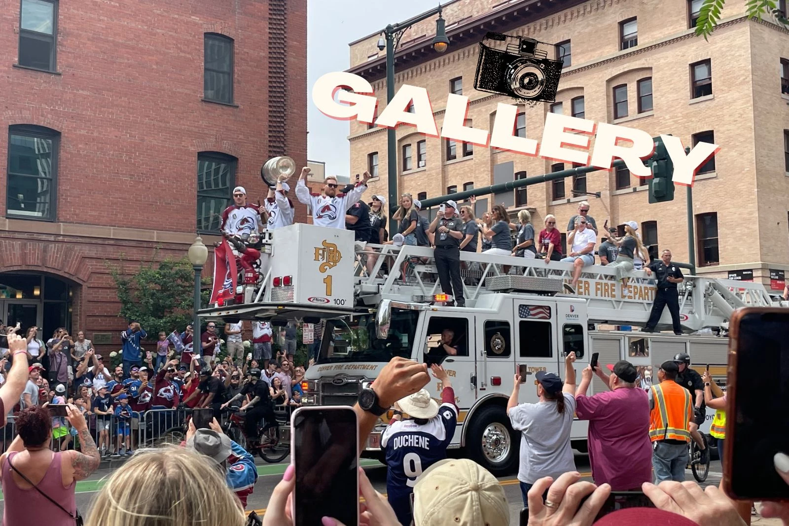 Colorado Avalanches Joe Sakic waves to the cheering crowd in a