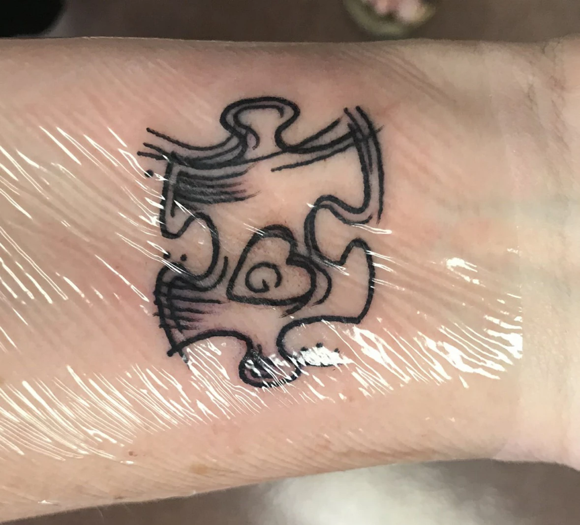 Dean at Old Traditions Parlor with this “Autism puzzle piece”  @deanpratt_tat2 was able to give his new client her first tattoo to ce... |  Instagram