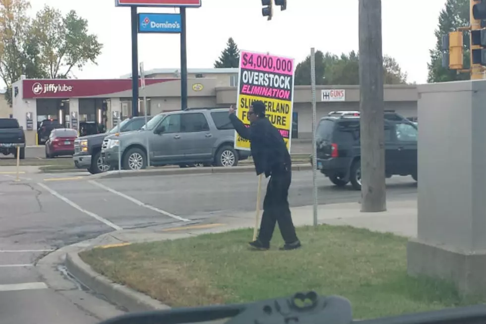 Sign Twirler in Bismarck Does More Than Twirl His Sign at Intersection  [VIDEO]