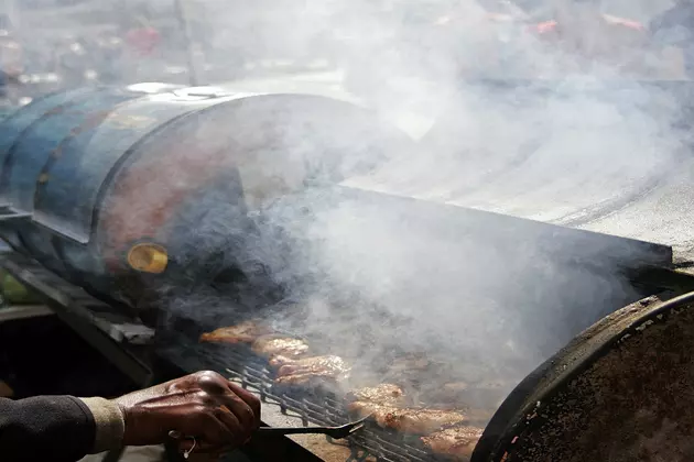 Man Steals Hot Meat From A Hot Smoker With His Bare Hands