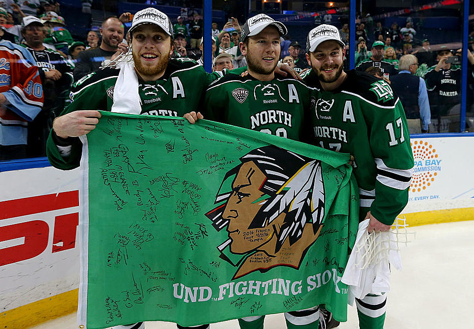 UND Hockey Player Plays A Game Before Game With Young Fan