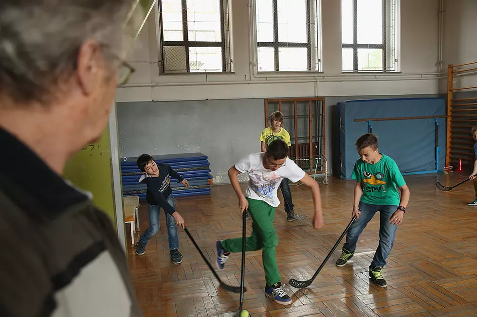 Shocking Video: Minnesota Teacher Throwing A Hockey Stick At Boy