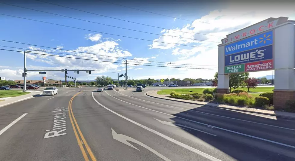 Businessman Holds Unusual Sign on Popular Grand Junction Street Corner