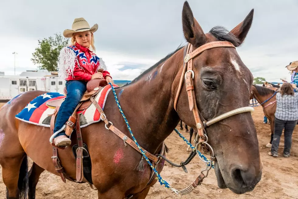 Cowgirl watches San Miguel Basin Rodeo, San Miguel County Fairgrounds
