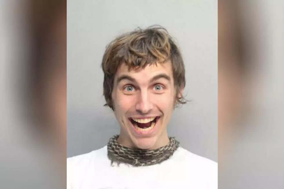 Protestor Fights Police With Dildo Proceeds to Take Best Mugshot Ever