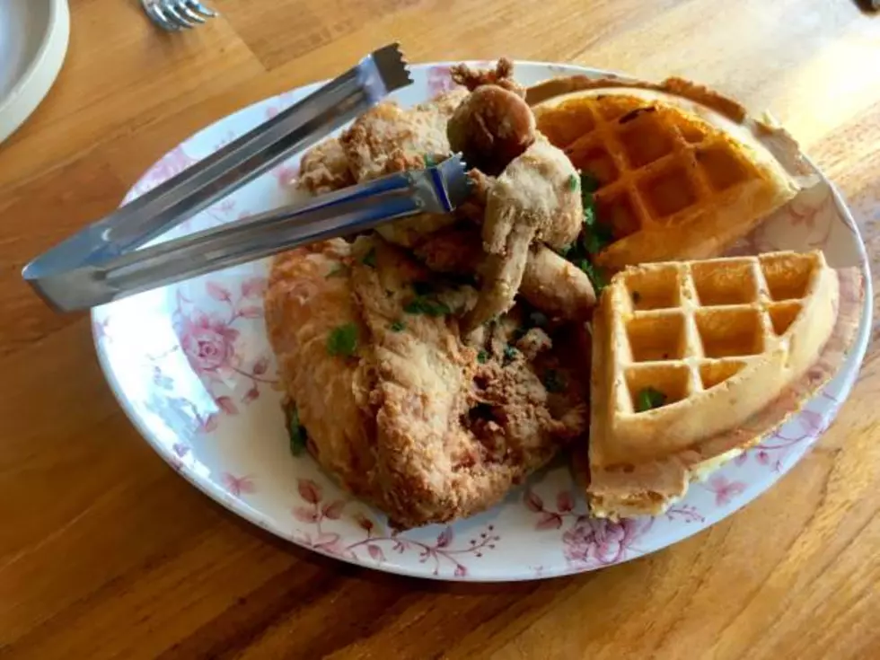 Close-up of a restaurant dish of chicken and waffles.