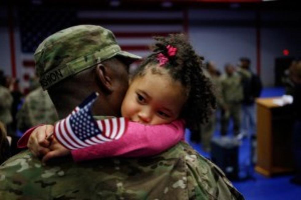 Professional Photo of Baby Wrapped in American Flag Has Set Off Controversy