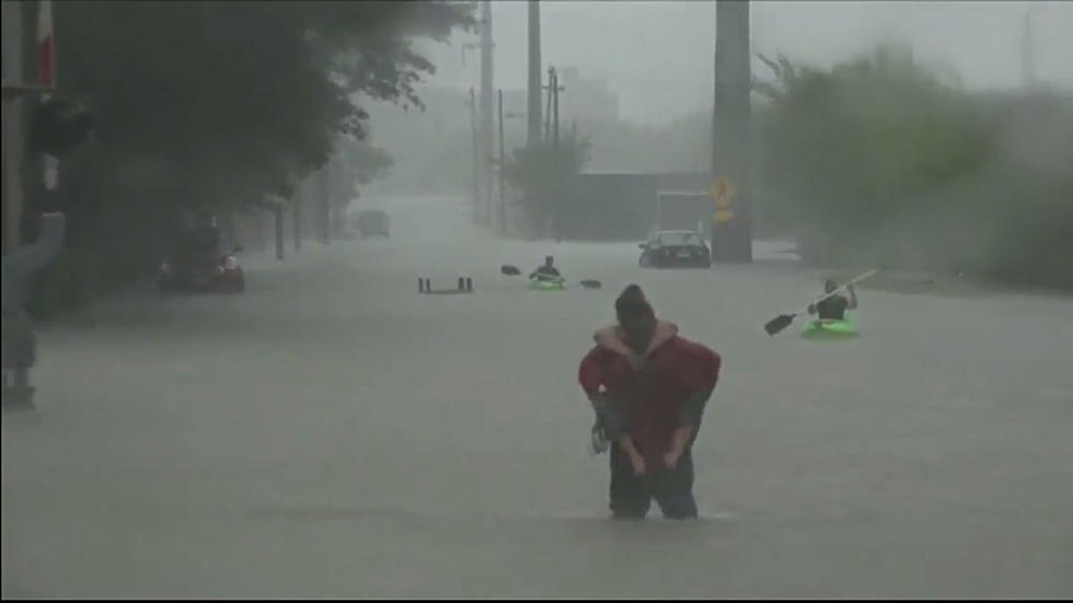 Surreal Footage of Houston Residents Escaping Hurricane Harvey Flooding