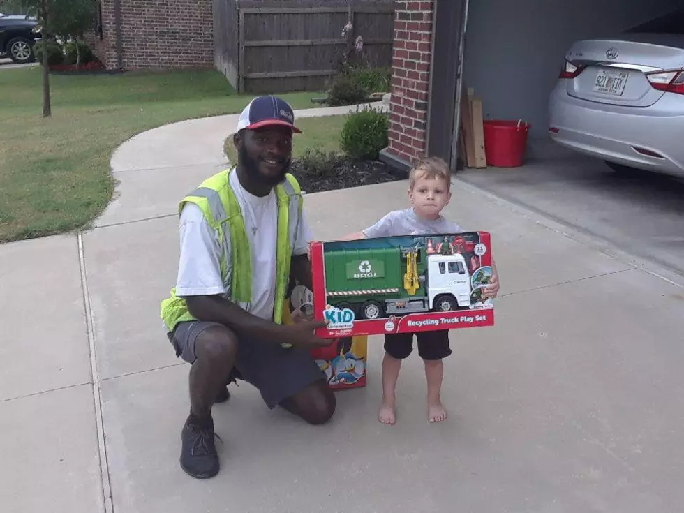 Sanitation Worker Gifts Young Friend A Toy Truck