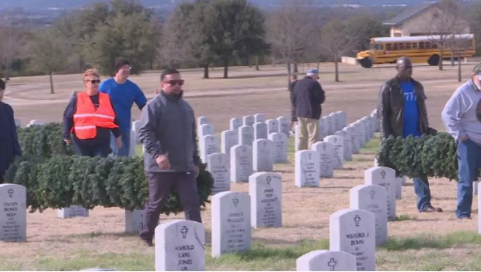 Hundreds Of Volunteers Collect Wreaths At Veterans Cemetery