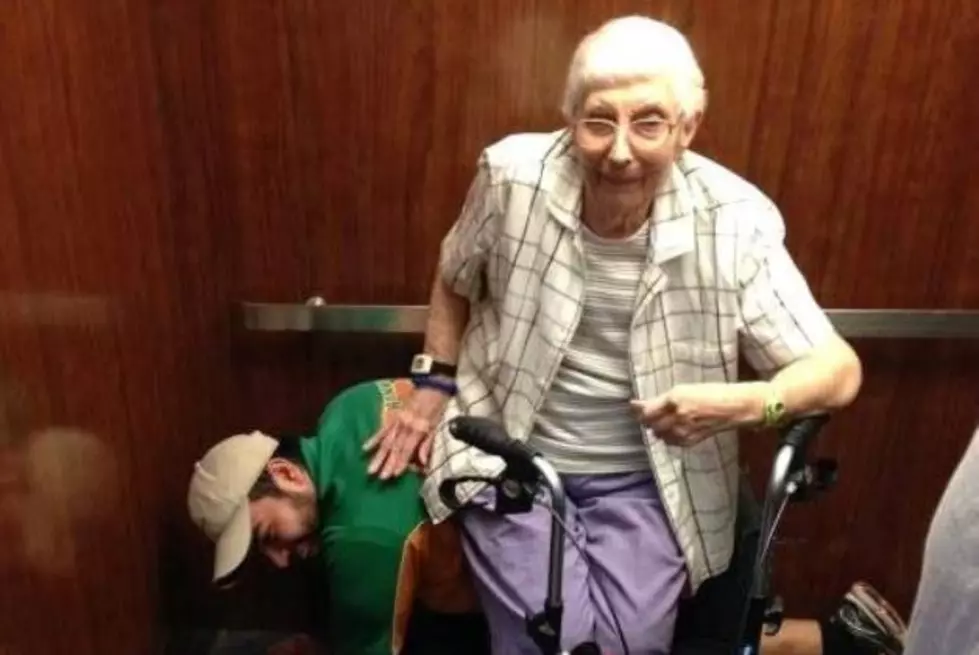 College &#8220;HUNK&#8221; Becomes a Human Bench for an Elderly Woman