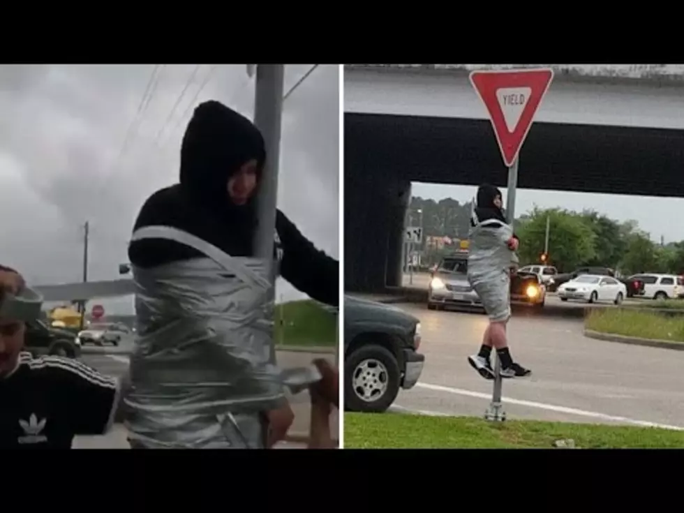 Texas Man Loses Bet, is Taped to Street Sign