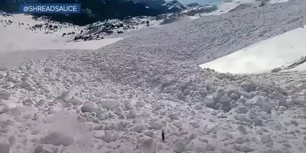 Watch Snowboarder Ride Out an Avalanche