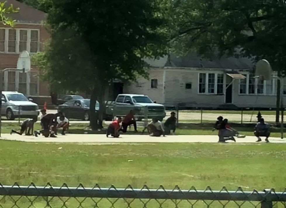 Teens Take Knee to Respect Funeral Procession