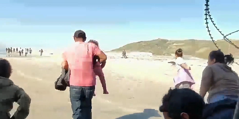 Video Shows Dozens of Migrants Crossing Into California