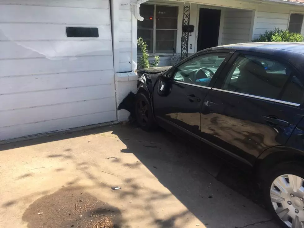 Woman Hospitalized After Crashing Car Into Temple Home