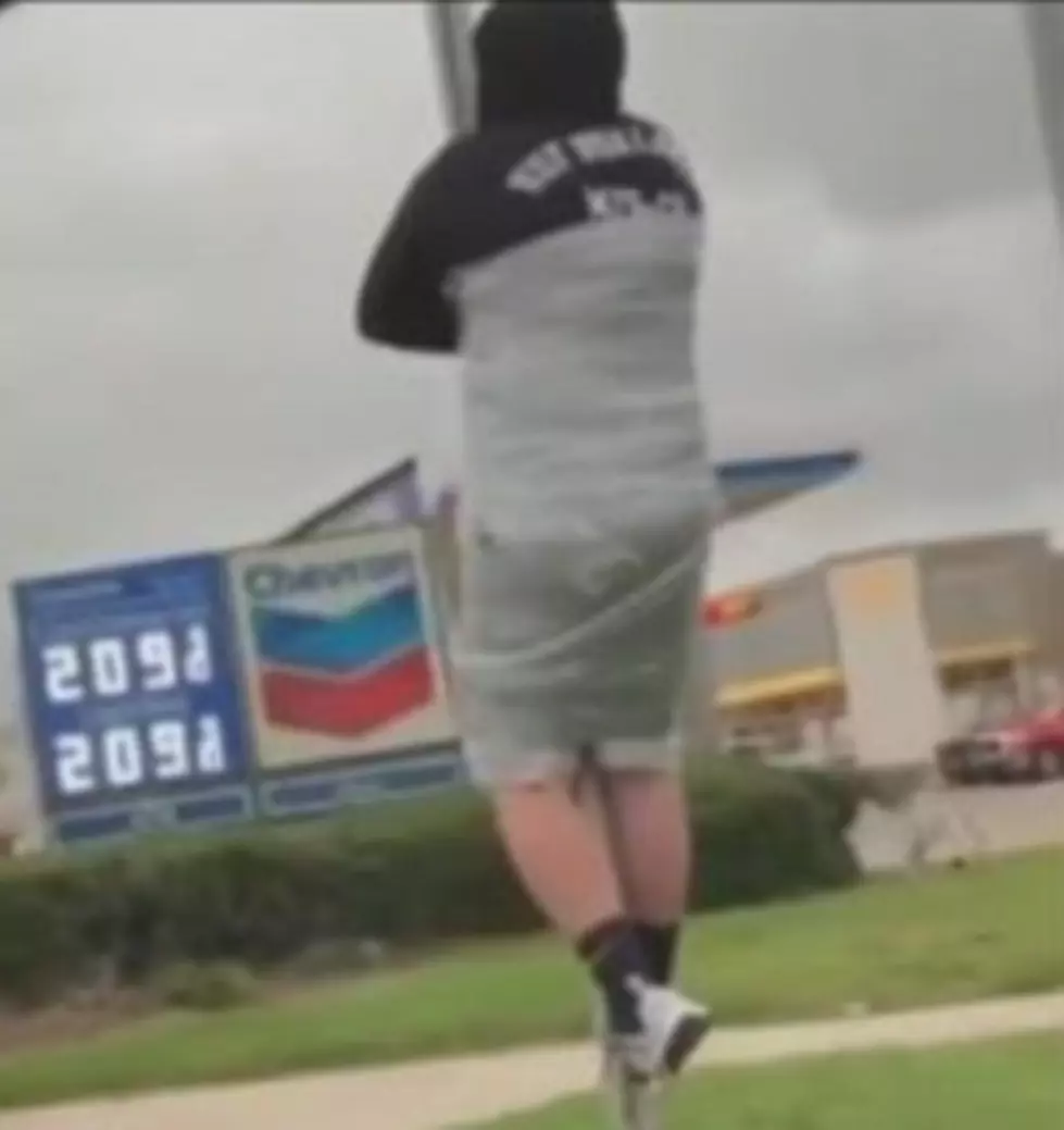 Texas Man duct taped to Yield sign after losing bet!