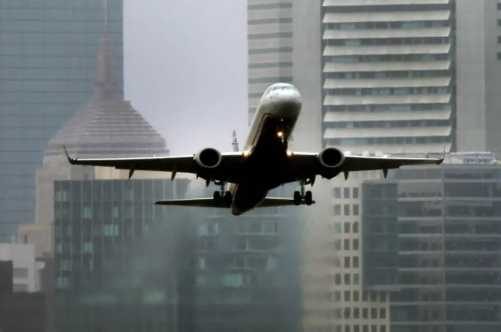 Drunken Woman Tries To Open Exit Door On Airliner