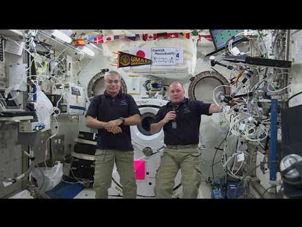 Astronaut Displays UMass Dartmouth Pennant on International Space Station