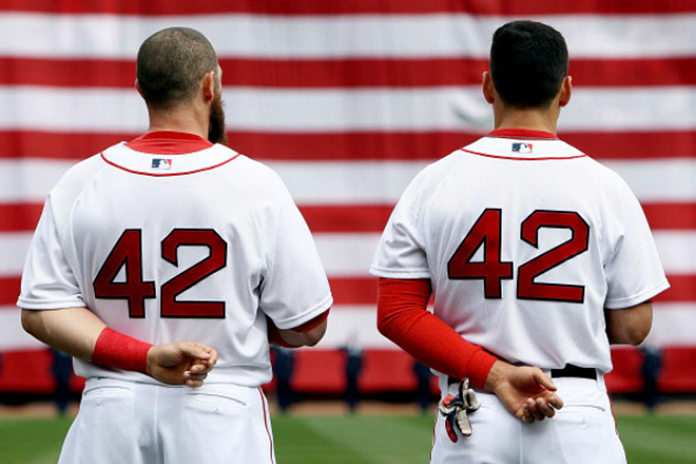 Why are MLB players wearing No. 42 jerseys today?