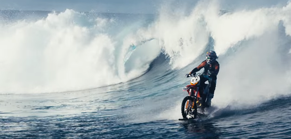 Daredevil Surfs Giant Wave On Dirt Bike [VIDEO]