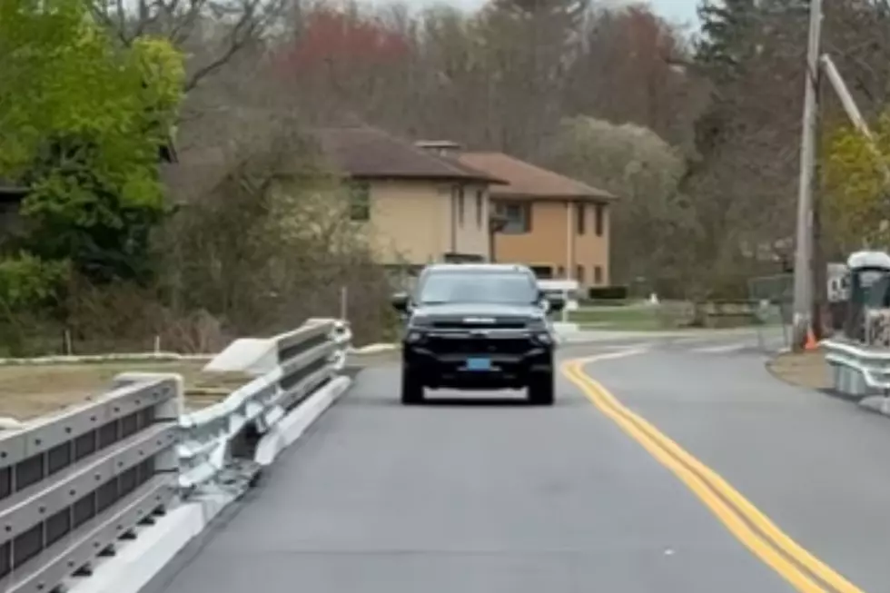 Sgt. Ashley becomes the first driver to cross Acushnet’s Hamlin Street Bridge as it reopens to traffic after a two-year closure for repairs.