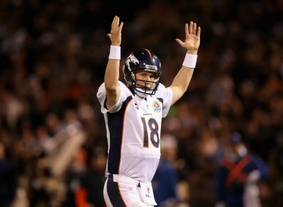 Manning Leads Broncos Past Raiders 26-13